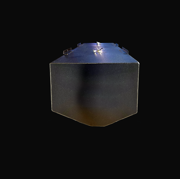A low-angle, end-profile studio view of the opposite end of a physical, finished black encapsulated 2003 Boston Whaler Outrage 240 OEM replacement marine fuel tank from file image_e685fe.jpg, isolated against a black background. This alternative perspective highlights the tank's pronounced V-shaped bottom deadrise geometry, custom-engineered to sit perfectly flush within the vessel's center hull stringer grid. Precision-fabricated from heavy-gauge marine-grade 5052-H32 aluminum, the structural 150-gallon ca