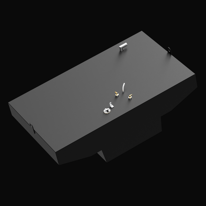 A 3D render of a dark grey boat fuel tank with a complex, notched shape and various brass and silver-colored fittings on its top surface, including D-rings on the ends, against a black background.