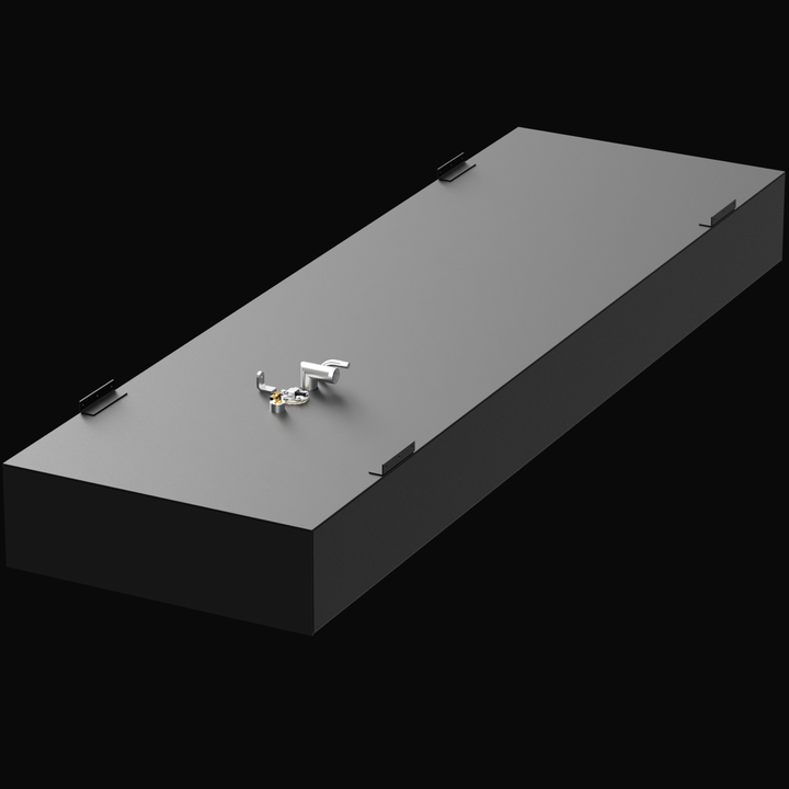 A 3D render of a long, rectangular, dark grey boat fuel tank, shown at an angle. The tank features a cluster of silver and brass-colored fittings and four corner mounting tabs on the top surface, against a black background.