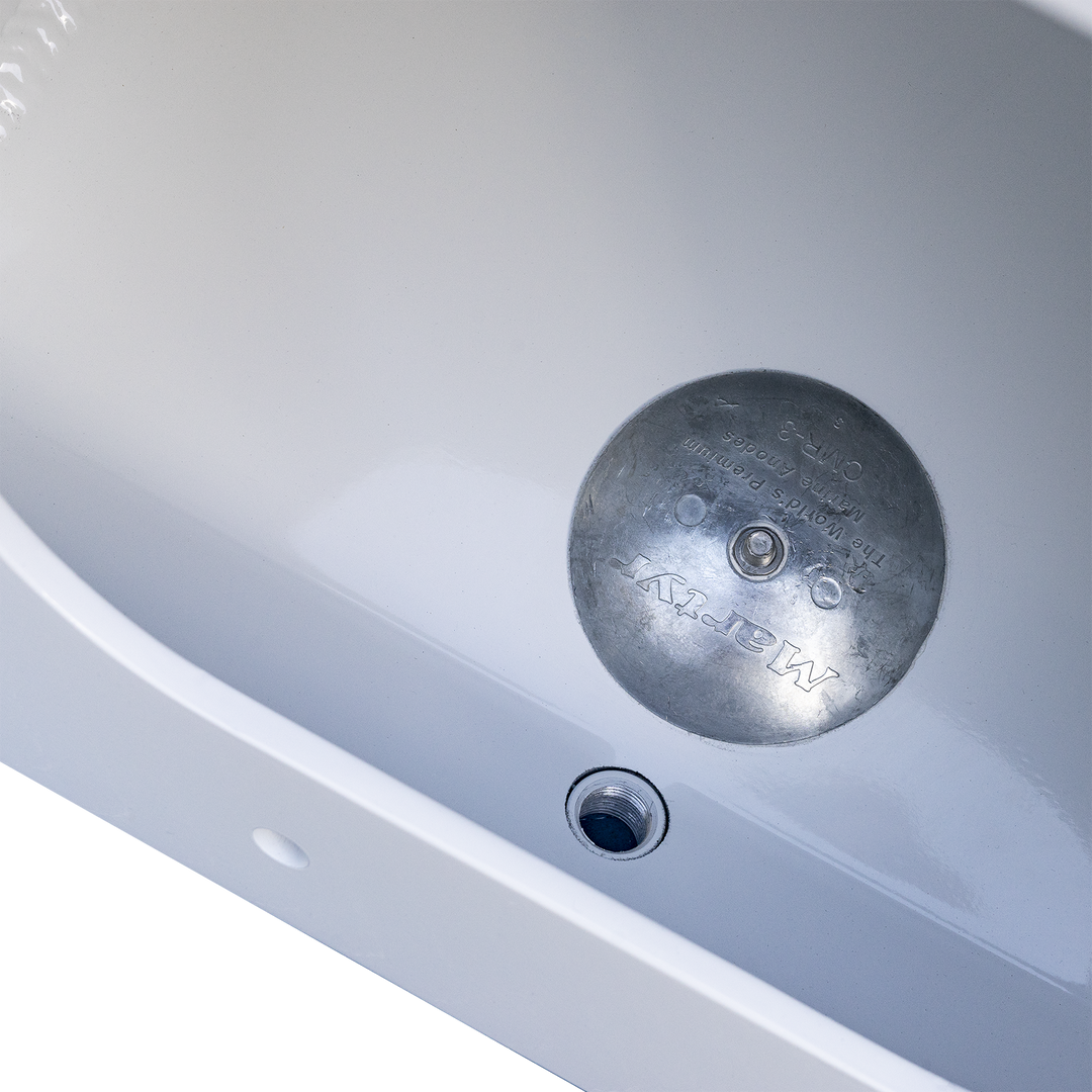 A close-up view of a white Apex single engine transom bracket with a 16° angle. The bracket features a circular metal plate in the center, engraved with the brand name "Apex," and a small drainage hole at the bottom. The background is transparent