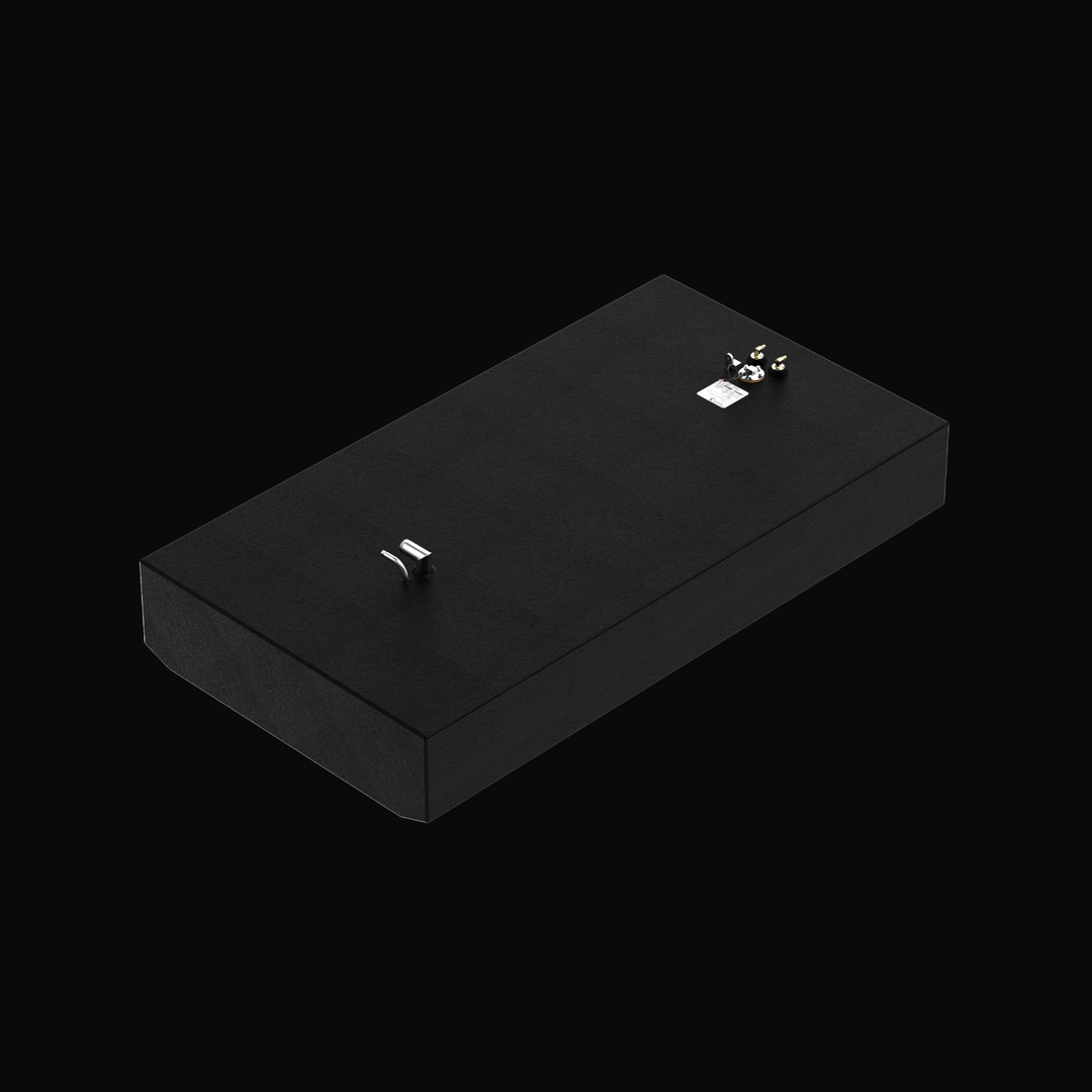 A high-angle isometric studio view of a physical, finished black encapsulated Grady White Freedom 255-257 OEM replacement marine fuel tank (135 gal) from file image_997843.jpg, isolated against a black background. Precision-fabricated from heavy-gauge marine-grade 5052-H32 aluminum, the long rectangular body features a tapered V-bottom deadrise engineered to rest flush within the vessel's center-cavity bilge compartment. The entire tank structure is fully encapsulated in a protective, textured black TarGard