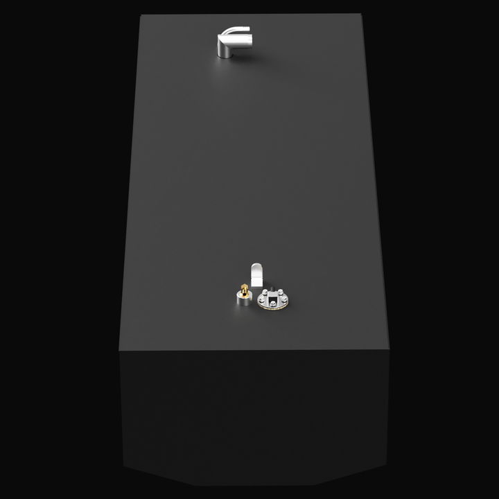 A 3D render showing a high-angle, top-down view of a long, dark grey fuel tank with silver and brass-colored fittings on its top surface, against a black background.