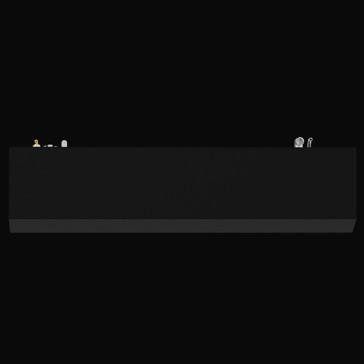 A 3D render showing a long side profile of a dark grey boat fuel tank, with various silver and brass-colored fittings visible on the top surface, against a black background.