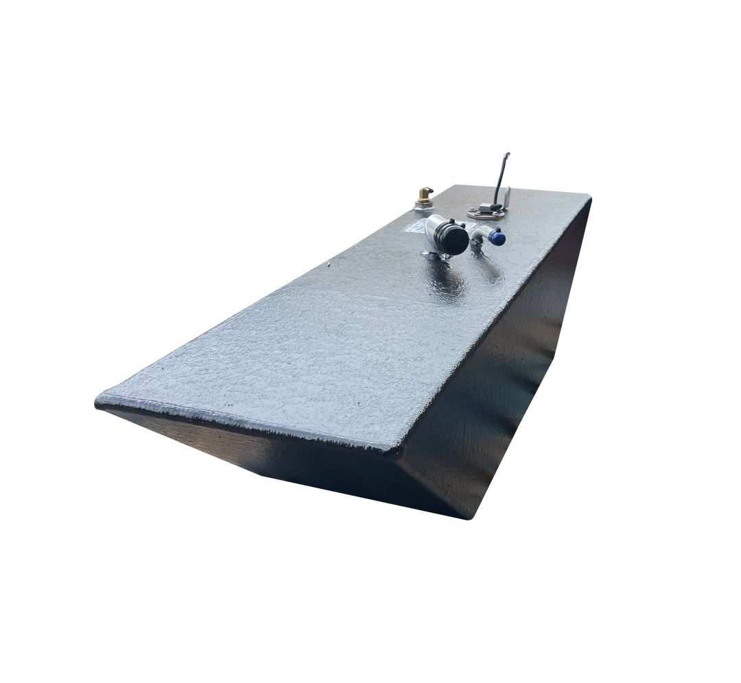 A low-angle photo of a long, wedge-shaped boat fuel tank with a dark, textured finish. The top surface shows various fittings, including a fuel sender and valve connections, against a transparent checkerboard background.