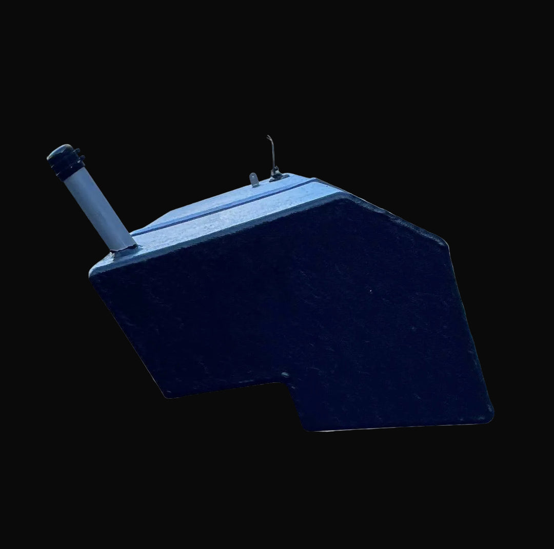 Close-up end profile of the Seacraft 32 replacement fuel tank, illustrating the specific notched corner and angled bottom designed for hull clearance. The image details the extended fill pipe and the unit's black protective finish.