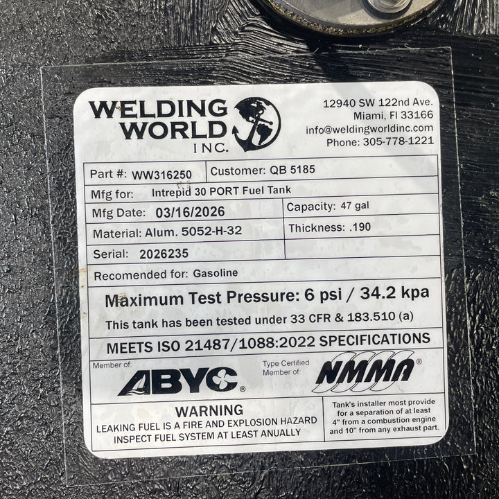 Close-up of an official Welding World Inc. manufacturing label for an Intrepid 30 port fuel tank. The label verifies a 47-gallon capacity, .190" Aluminum 5052-H32 construction, and compliance with USCG 33 CFR & 183.510 (a) and ISO 21487/1088:2022 specifications. Detailed certification markings from ABYC and NMMA guarantee a high-quality, pressure-tested OEM replacement.