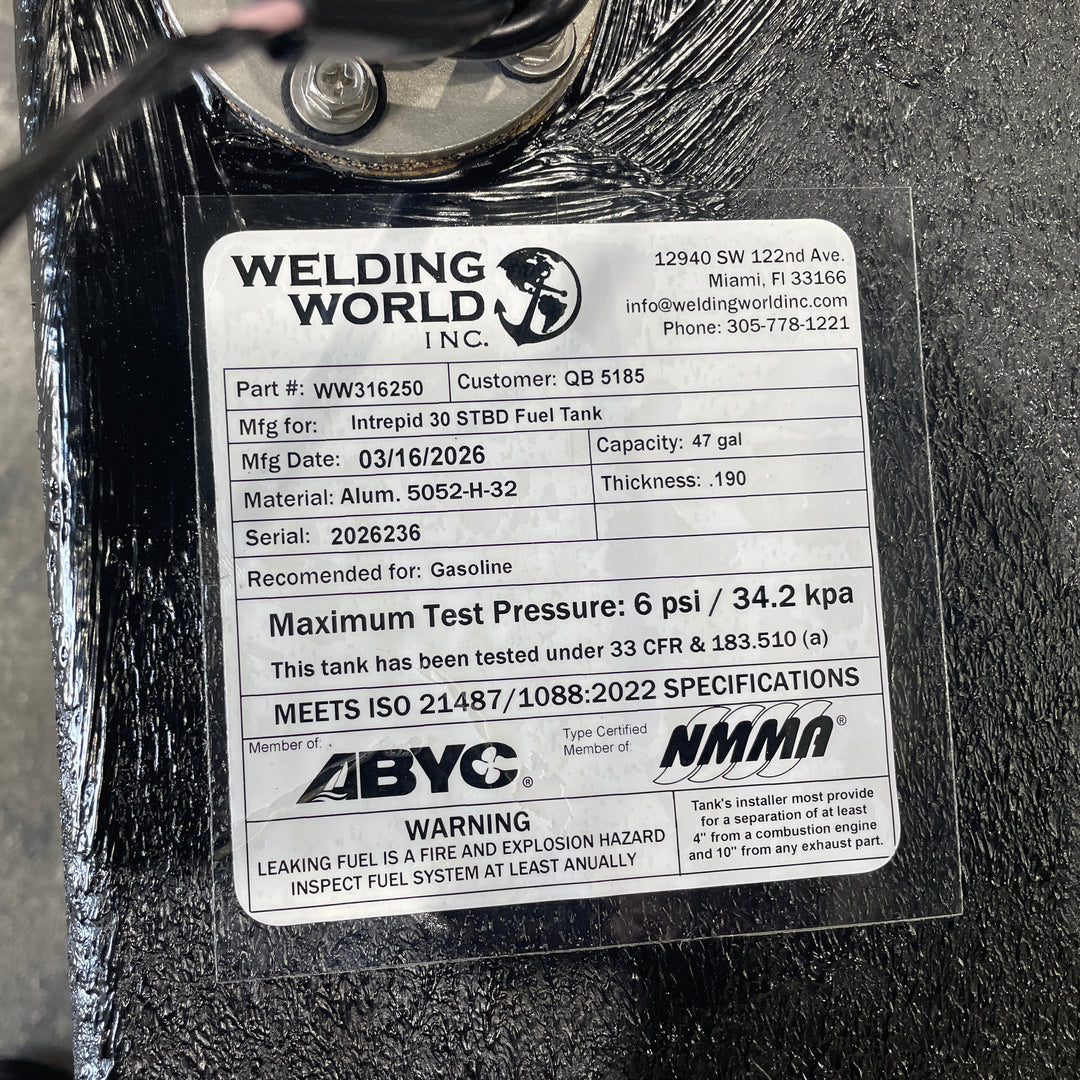 Close-up of an official Welding World Inc. manufacturing label for an Intrepid 30 starboard (STBD) fuel tank. The label verifies a 47-gallon capacity, .190" Aluminum 5052-H32 construction, and compliance with USCG 33 CFR & 183.510 (a) and ISO 21487/1088:2022 specifications. Detailed certification markings from ABYC and NMMA guarantee a high-quality, pressure-tested OEM replacement.