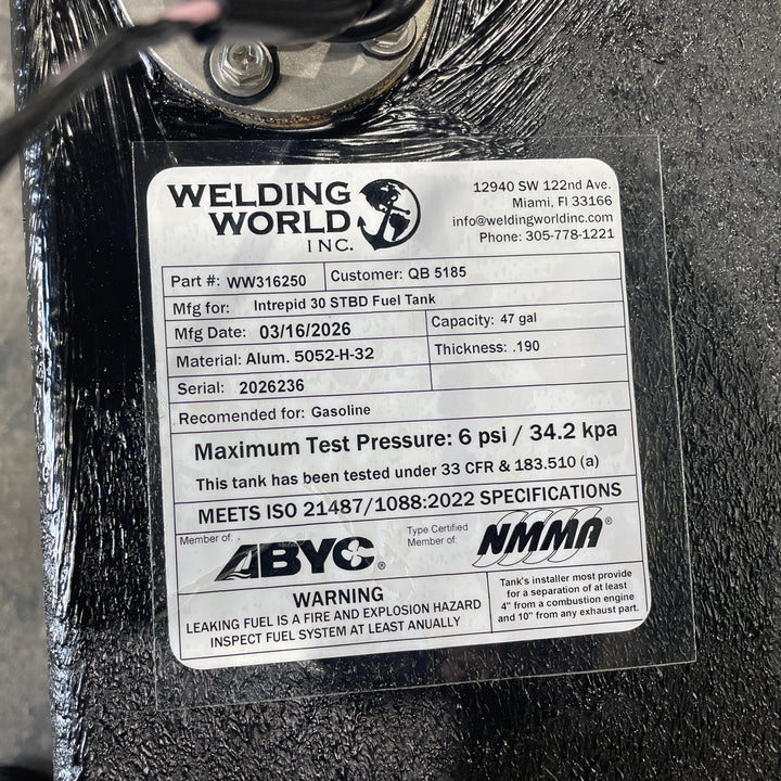 Close-up of an official Welding World Inc. manufacturing label for an Intrepid 30 starboard (STBD) fuel tank. The label verifies a 47-gallon capacity, .190" Aluminum 5052-H32 construction, and compliance with USCG 33 CFR & 183.510 (a) and ISO 21487/1088:2022 specifications. Detailed certification markings from ABYC and NMMA guarantee a high-quality, pressure-tested OEM replacement.