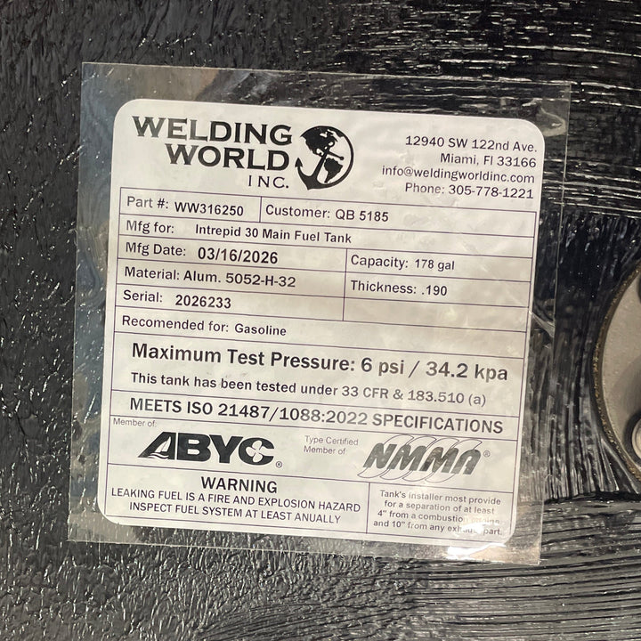 Close-up of an official Welding World Inc. manufacturing label for an Intrepid 30 main fuel tank. The label verifies a 178-gallon capacity, .190" Aluminum 5052-H32 construction, and compliance with USCG 33 CFR & 183.510 (a) and ISO 21487/1088:2022 specifications. Detailed certification markings from ABYC and NMMA guarantee a high-quality, pressure-tested OEM replacement.