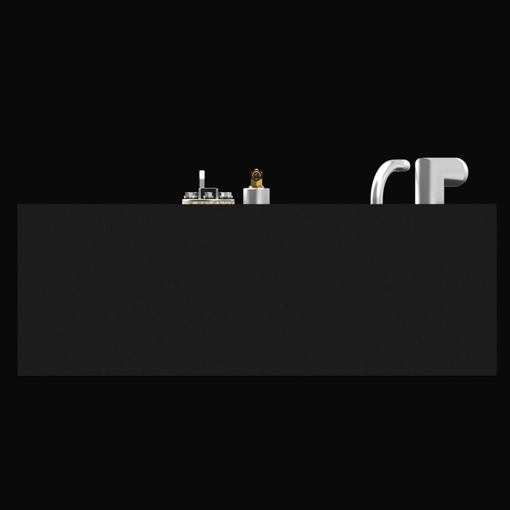 A matte black rectangular marine fuel tank is shown from the front view against a black background. The top edge of the tank has several fittings: on the left, a round metal valve assembly with a lever, next to it a gold valve, and on the right side two silver curved metal pipe fittings