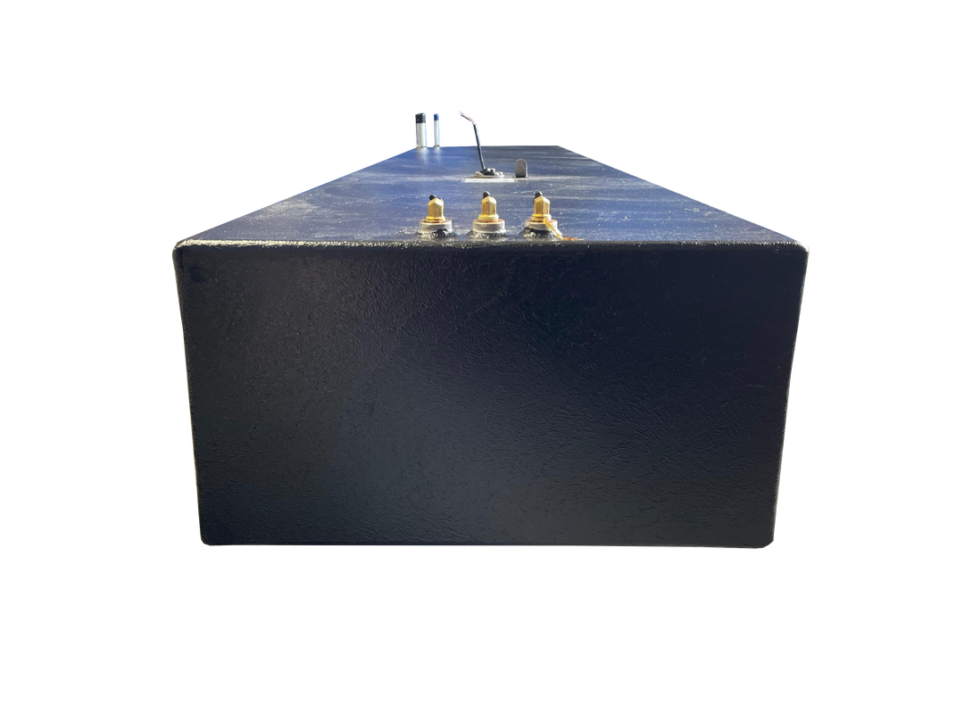 A low-angle photo of a long, dark blue, textured boat fuel tank, showing the end panel and top surface. Various fittings are visible, including three brass-colored fittings, a fuel sending unit, and two tall silver pipes, all against a transparent checkerboard background.