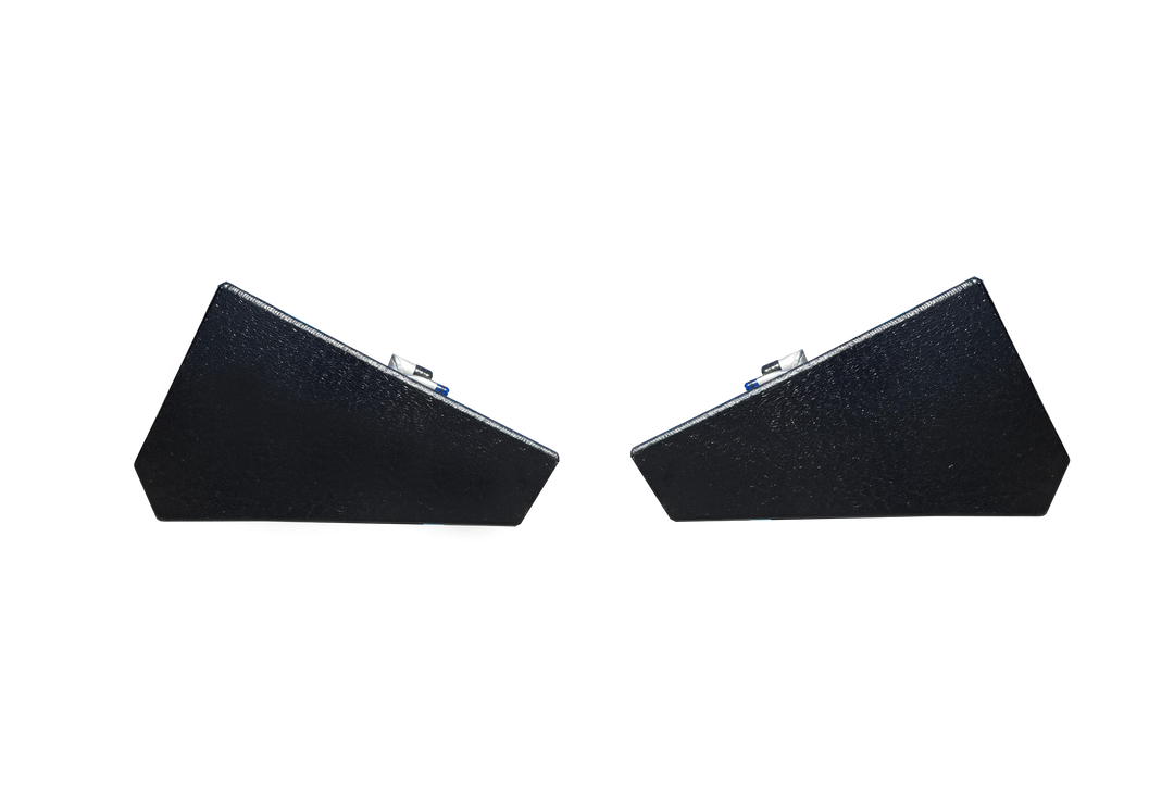 A profile view of the ends of two dark, textured, wedge-shaped boat fuel tanks, shown side-by-side against a transparent checkerboard background.
