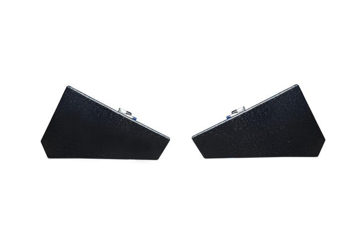 A profile view of the ends of two dark, textured, wedge-shaped boat fuel tanks, shown side-by-side against a transparent checkerboard background.
