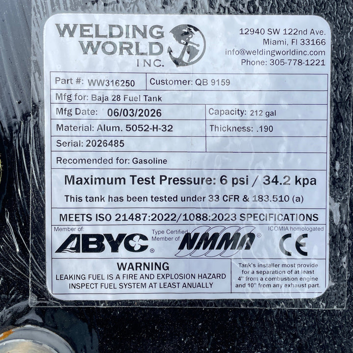 Close-up top-deck hardware layout view of a black Baja 28 replacement marine fuel tank. The image focuses on a manufacturer specification data placard listing part number WW316250, customer code QB 9159, and a manufacturing date of 06/03/2026. Fabricated from heavy-gauge marine-grade 5052-H32 aluminum with a thickness of .190, the 212-gallon capacity center-hull tank body is fully encapsulated in a textured, anti-corrosive black TarGard epoxy coating. Every unit is precision-engineered by Welding World in c