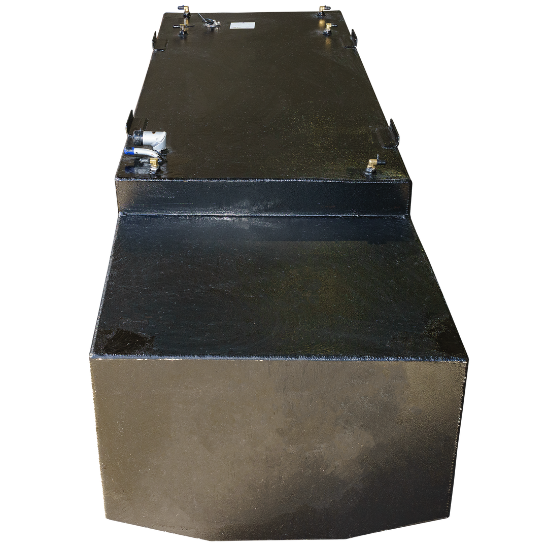 A top view of a black rectangular fuel tank, showcasing a smooth surface with various ports and fittings, including a blue connector. The tank has a distinct two-level design and is set against a transparent checkered background
