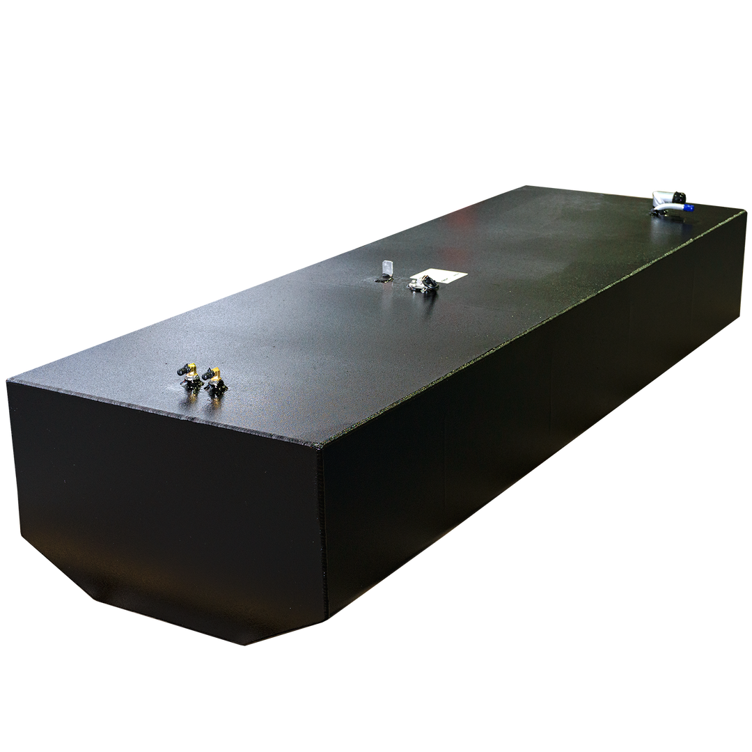 An eye-level shot of a rectangular black metal tank with a textured surface, featuring various small fittings on its top. A white sticker is visible near the center of the tank's top. The background is a repeating pattern of black and transparent squares