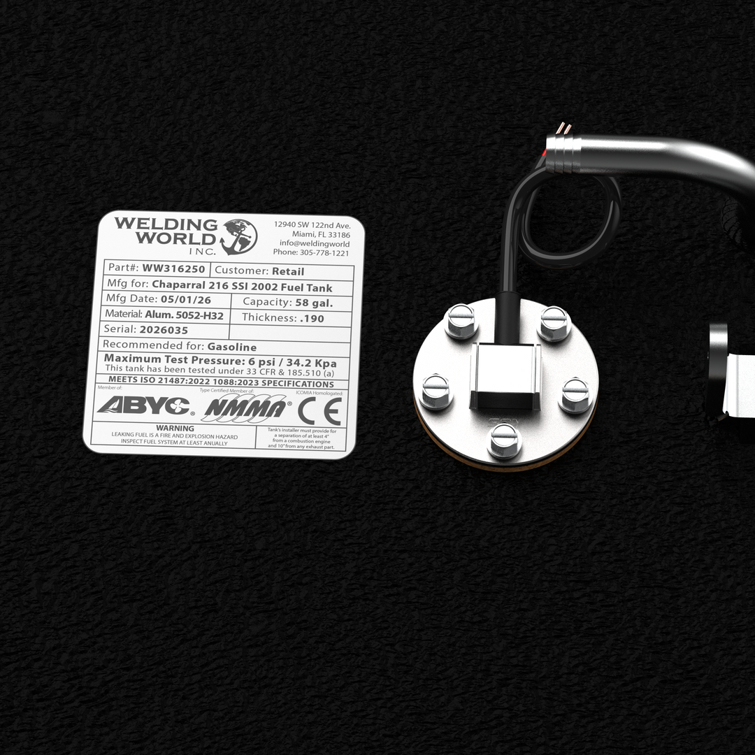 Close-up detail of the official Welding World Inc. manufacturing label and integrated fuel sending unit on a Chaparral 216 SSI (2002) fuel tank. The label confirms a 58-gallon capacity, .190" thickness 5052-H32 marine-grade aluminum construction, and compliance with ABYC, NMMA, and CE standards. Finished in protective black Coal Tar Epoxy, this tank is engineered for a guaranteed 100% drop-in fit.