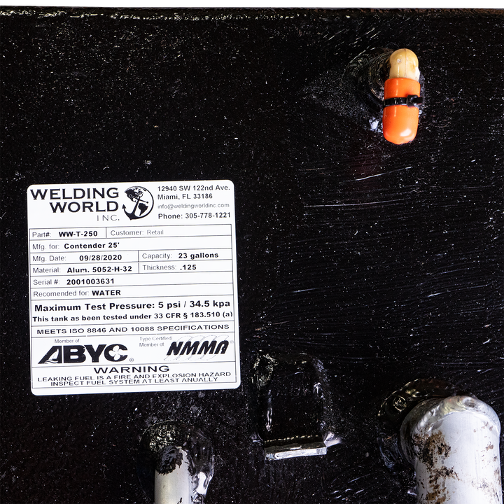 Close-up of a fuel and water tank combo for a 1993 Contender 25' boat, featuring a label from Welding World, Inc. The label indicates a fuel capacity of 180 gallons and a water capacity of 23 gallons, with a maximum pressure of 5 psi and a weight of 34.5 kg. The tank is equipped with a float indicator and is marked with safety warnings