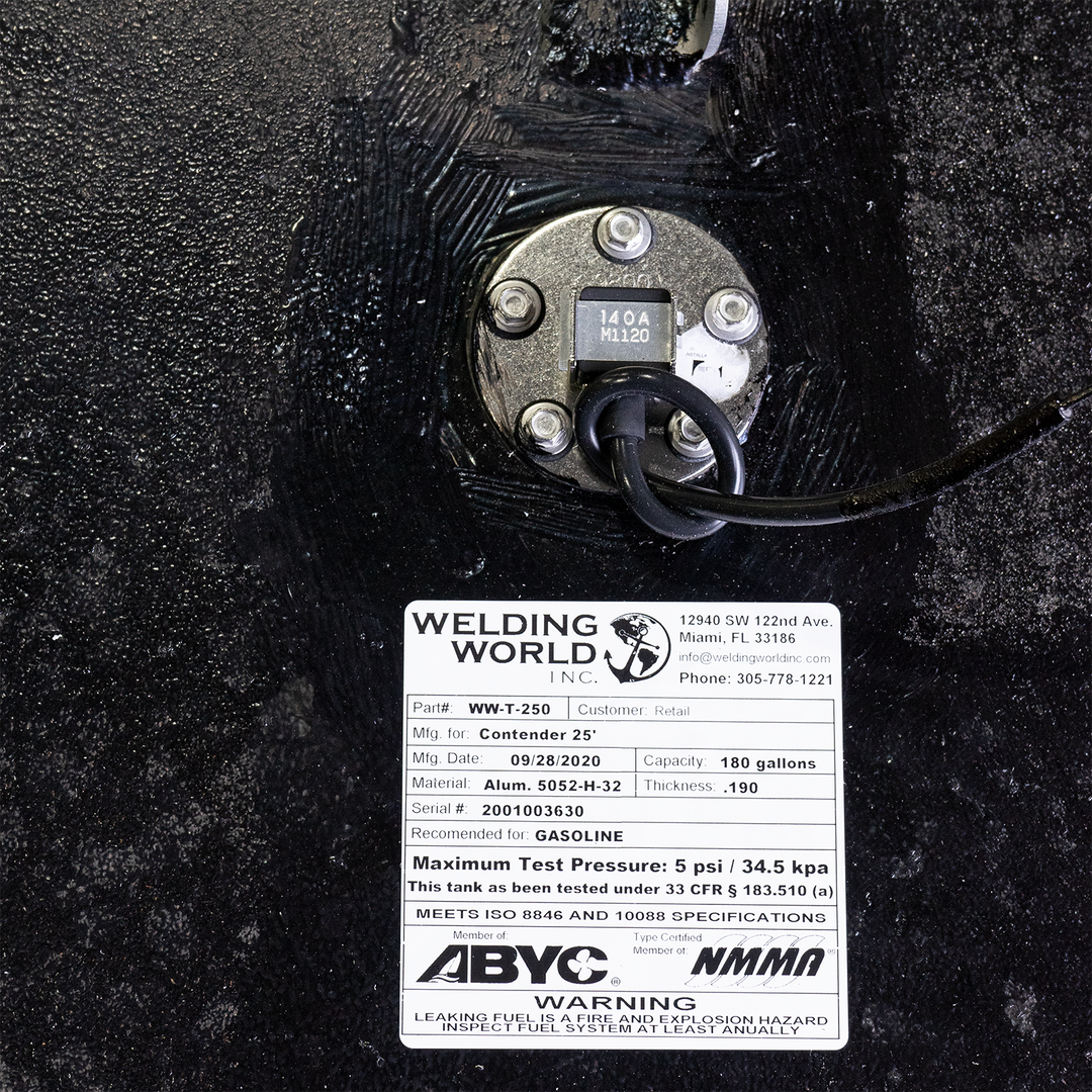 Close-up of a fuel and water tank combo for a 1993 Contender 25' boat, showing a fuel fill cap labeled '140A M120' and a specification label indicating a fuel capacity of 180 gallons and a water capacity of 23 gallons, with a maximum test pressure of 5 psi