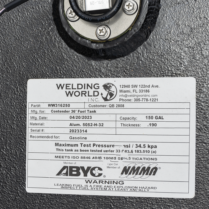 Close-up of a Welding World Inc. label on a black aluminum fuel tank. The label lists part number WW316250 for a Contender 36' fuel tank, manufactured on 04/20/2023. Capacity is 150 gallons, made of Aluminum 5052-H-32 with 0.190-inch thickness. Serial number 2023314. Recommended for gasoline. Certified by ABYC and NMMA, meeting ISO 8846 standards. Warning about fire and explosion hazard from leaking fuel. Contact info includes Miami, FL address and phone number 305-778-1221