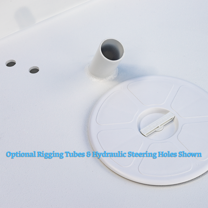 A close-up of a white boat surface showing an optional rigging tube and hydraulic steering hole. The image features a cylindrical rigging tube protruding from the surface, two small circular holes, and a round hatch cover with a handle. Text in blue at the bottom reads, "Optional Rigging Tubes & Hydraulic Steering Holes Shown