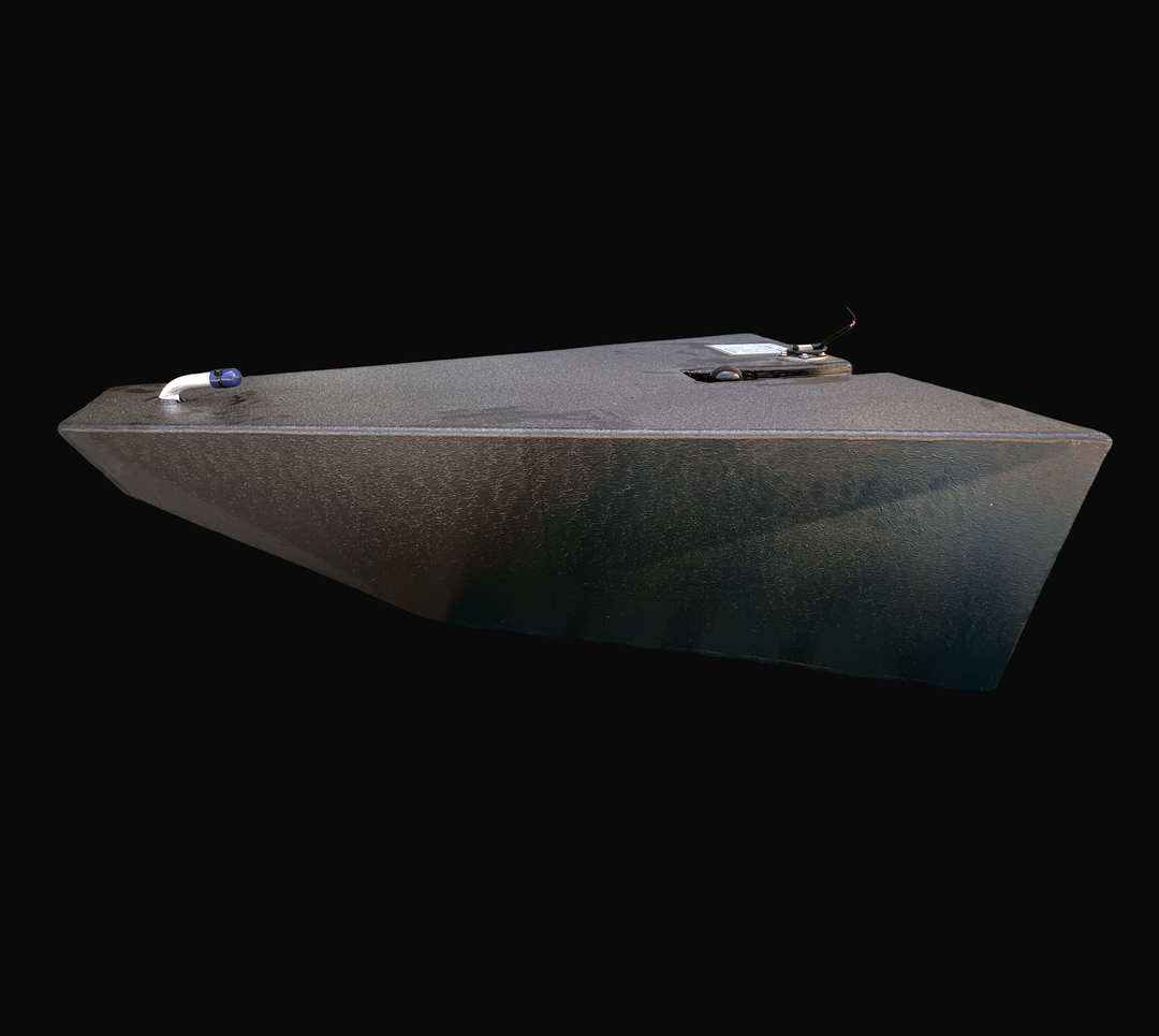An eye-level studio side profile view displaying the tapered wedge hull geometry of a physical, finished black encapsulated Dolphin Skiffs 16 OEM replacement marine fuel tank (25 gal 1998) from file image_433115.jpg, isolated against a black background. Precision-fabricated from heavy-gauge marine-grade 5052-H32 aluminum, the custom-contoured bow-wedge body is fully encapsulated in a protective, textured black TarGard epoxy coating to resist severe saltwater pitting and bilge moisture decay. The profile hig