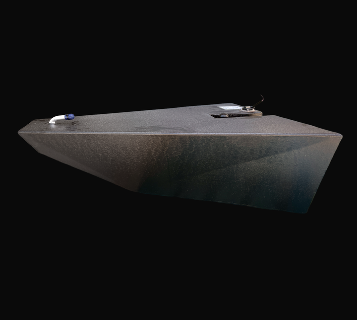 An eye-level studio side profile view displaying the tapered wedge hull geometry of a physical, finished black encapsulated Dolphin Skiffs 16 OEM replacement marine fuel tank (25 gal 1998) from file image_433115.jpg, isolated against a black background. Precision-fabricated from heavy-gauge marine-grade 5052-H32 aluminum, the custom-contoured bow-wedge body is fully encapsulated in a protective, textured black TarGard epoxy coating to resist severe saltwater pitting and bilge moisture decay. The profile hig