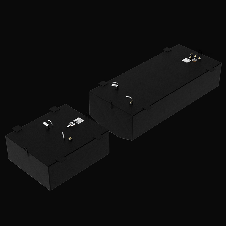 A studio high-angle isometric perspective view displaying the physical, finished black encapsulated dual-tank set for the Donzi 35ZF Aux (75 gal) & Main (186 gal) 2003 OEM replacement marine fuel tanks from file image_8483ce.jpg, isolated against a black background. Precision-fabricated from heavy-gauge marine-grade 5052-H32 aluminum, both contoured hull tanks are fully encapsulated in a protective, textured black TarGard epoxy coating to resist severe saltwater pitting and bilge moisture decay. Top deck ha