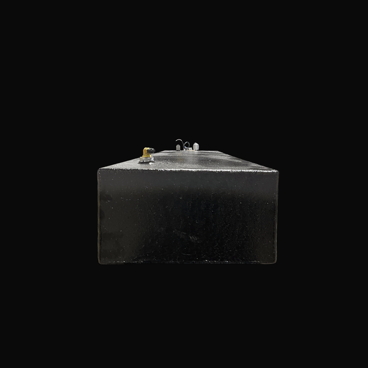 A studio front-facing end perspective view looking down the length of a physical, finished black encapsulated Eagle 17 OEM replacement marine fuel tank (29 gal 2000) from file image_495e1d.jpg, isolated against a black background. Precision-fabricated from heavy-gauge marine-grade 5052-H32 aluminum, the long low-profile rectangular body is fully encapsulated in a protective, textured black TarGard epoxy coating to resist severe saltwater pitting and bilge moisture accumulation. The top deck configuration hi