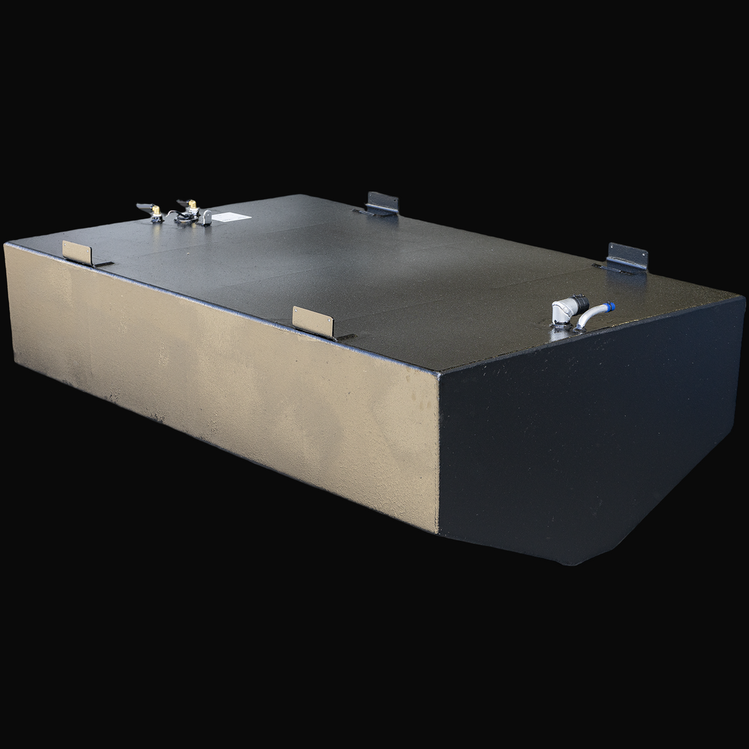A black rectangular metal fuel tank with welded brackets on top, a pipe and connector on one side, and a textured finish. The tank has beveled corners on the front and sits on a transparent background