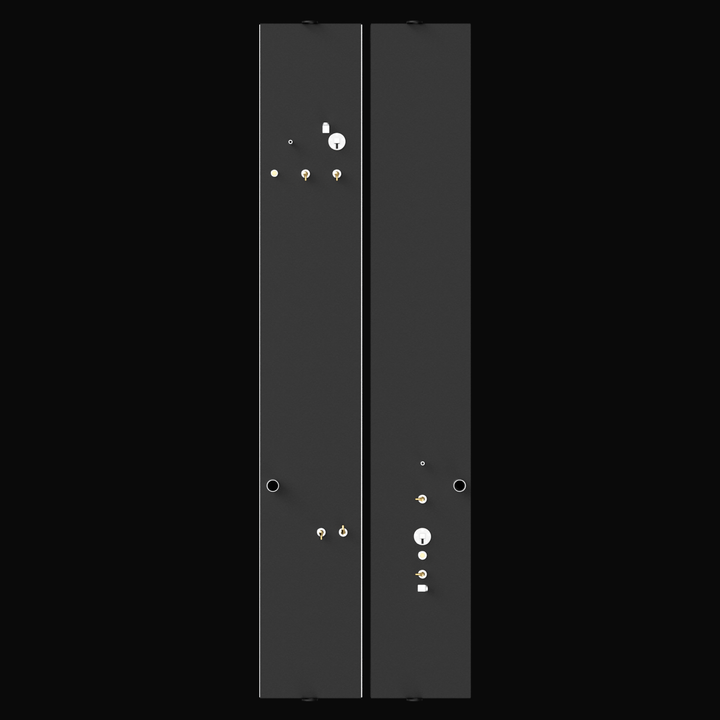 Top-down view of two long, narrow black fuel tanks placed side by side on a black background. Both tanks have multiple metallic fittings and valves on their top surfaces, including gold and silver connectors, caps, and pipes. The tanks have circular openings near the bottom edges and various small mounting brackets along their edges.