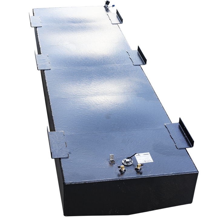 A high-angle view looking down the entire length of a very long, rectangular boat fuel tank with a black, semi-gloss coating. Numerous L-shaped mounting tabs line both top edges of the tank. A single cluster of fittings, including a fuel sending unit and two brass connectors, is located on the top surface at the near end. The tank is set against a checkered background