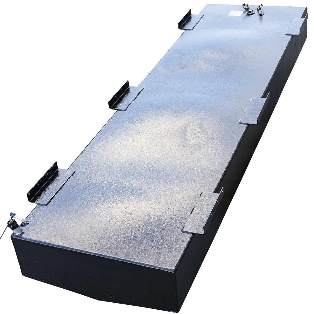 A high, three-quarter profile view of a very long, rectangular boat fuel tank with a black, semi-gloss coating, set against a checkered background. Numerous L-shaped mounting tabs are welded along the top edges. Two distinct clusters of fittings are located at opposite ends of the top surface: one features a fuel sending unit with a valve, while the other contains two brass fittings and a label