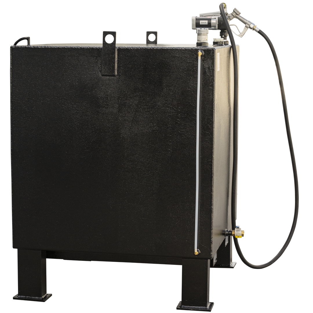 A black, rectangular fuel tank with a textured finish, viewed from a slight angle. It has four sturdy legs, two visible at the front. A fuel pump and nozzle assembly is on the top right, with a black hose extending downwards. A white translucent tube runs vertically along the right side, and a brass valve with a blue handle is visible near the bottom right. Two lifting hooks are on the top surface