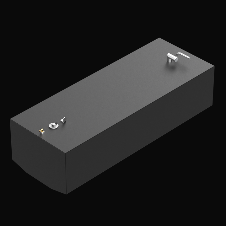 A 3D model rendering of a rectangular black fuel tank with a flat top. It has two protruding pipes on the left side and multiple fittings including a capped inlet and a mounting bracket on the right side. The front bottom edge of the tank is angled inward. The overall shape is boxy and smooth