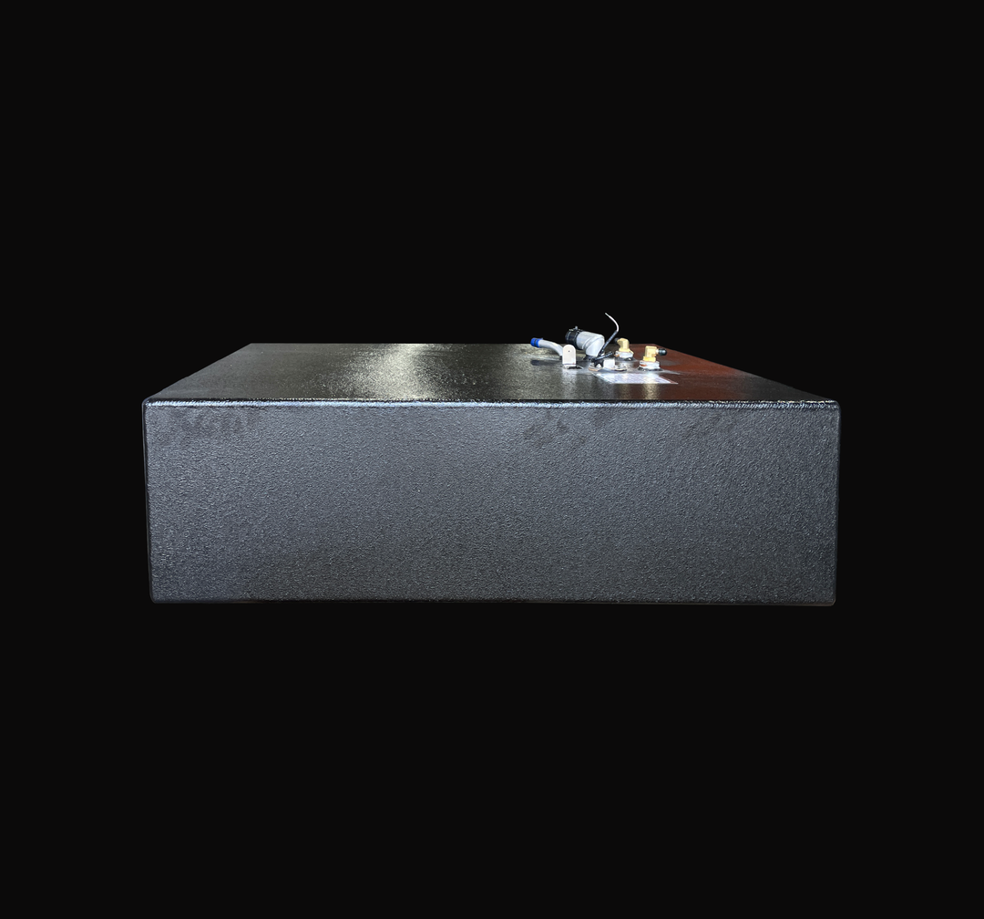A front profile view of the Grady White 25 Sailfish auxiliary replacement fuel tank, highlighting its low-profile rectangular body and premium textured black TarGard epoxy coating. This angle showcases the clean, seamless weld lines and the heavy-duty marine-grade aluminum construction. The top-deck hardware cluster is visible on the upper right, including the fuel fill neck, brass fuel line pickups, and vent fittings. Precision-engineered by Welding World for a guaranteed 100% drop-in fit.