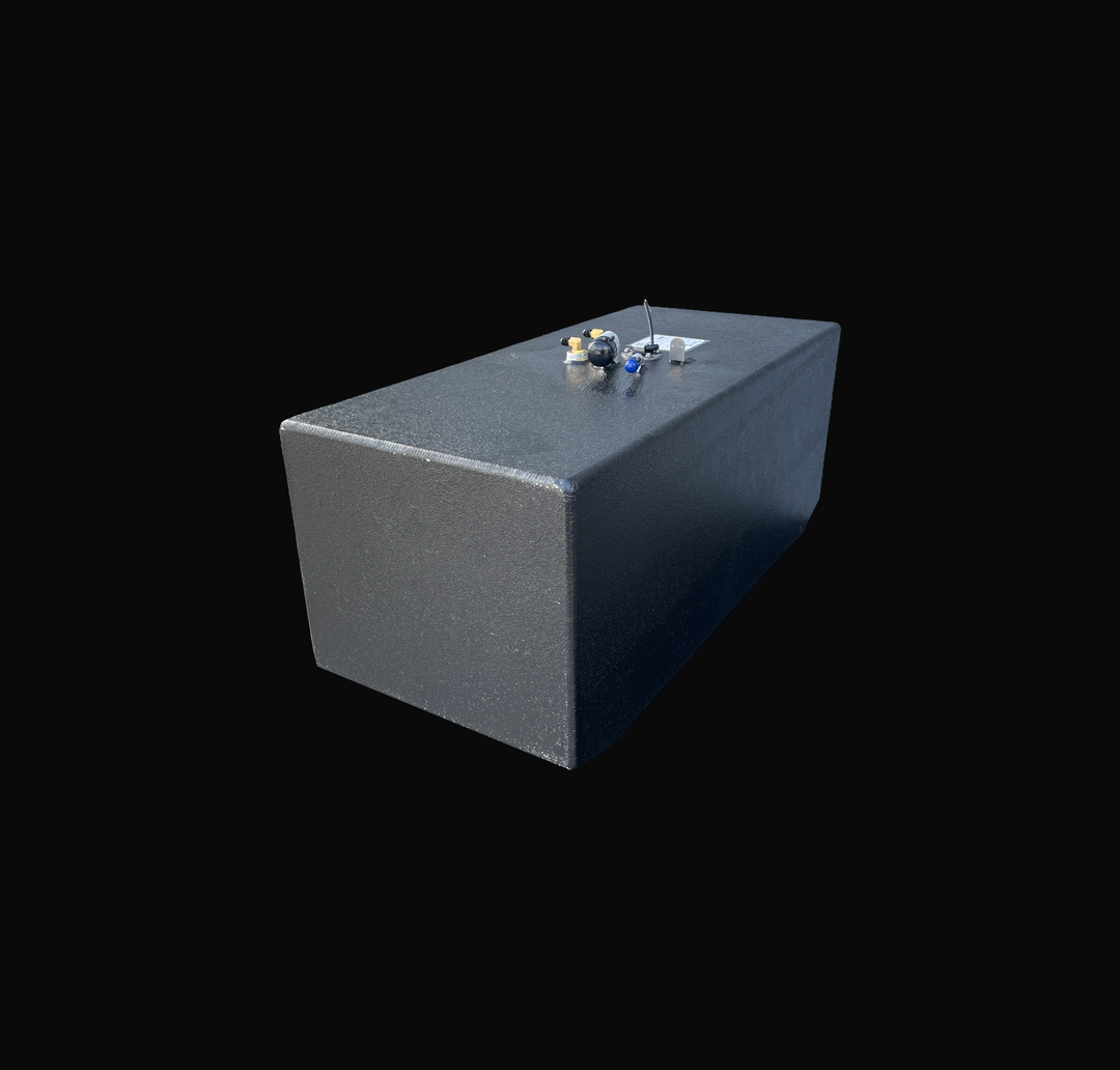 A studio high-angle isometric view displaying the full length of a physical, finished black encapsulated Grady White 272 Sailfish AUX OEM replacement marine fuel tank (52 gal) from file image_2a34ad.jpg, isolated against a black background. Precision-fabricated from heavy-gauge marine-grade 5052-H32 aluminum, the rectangular body is fully encapsulated in a protective, textured black TarGard epoxy coating to resist severe saltwater pitting and bilge moisture decay. Top deck hardware features a brass 90-degre