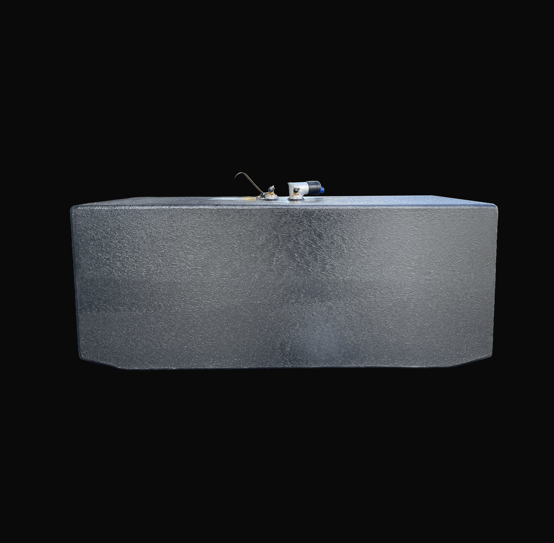 An eye-level studio side profile view displaying the full length of a physical, finished black encapsulated Grady White 272 Sailfish AUX OEM replacement marine fuel tank (52 gal) from file image_2a33b4.jpg, isolated against a black background. Precision-fabricated from heavy-gauge marine-grade 5052-H32 aluminum, the rectangular body is fully encapsulated in a protective, textured black TarGard epoxy coating to resist severe saltwater pitting and bilge moisture decay. Top deck hardware features mid-mounted f