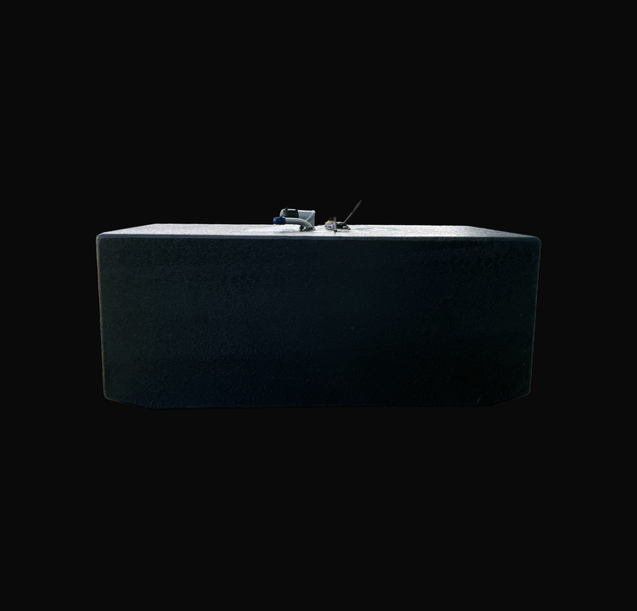 An eye-level studio side profile view displaying the full length of a physical, finished black encapsulated Grady White 272 Sailfish AUX OEM replacement marine fuel tank (52 gal) from file image_2a33f8.jpg, isolated against a black background. Precision-fabricated from heavy-gauge marine-grade 5052-H32 aluminum, the deep rectangular body is fully encapsulated in a protective, textured black TarGard epoxy coating to resist severe saltwater pitting and bilge moisture decay. Top deck hardware features mid-moun