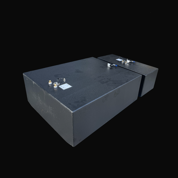 A studio high-angle isometric view displaying both primary and auxiliary tanks of a physical, finished black encapsulated Grady White 272 Sailfish OEM replacement marine fuel tank combo set from file image_2a3f1c.jpg, isolated against a black background. Precision-fabricated from heavy-gauge marine-grade 5052-H32 aluminum, both custom rectangular bodies are fully encapsulated in a protective, textured black TarGard epoxy coating to resist severe saltwater pitting and bilge moisture decay. Foreground deck ha