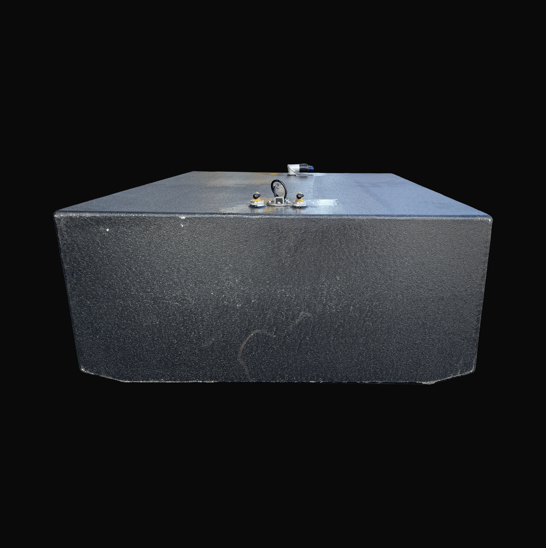 A studio front-facing end perspective view looking down the full length of a physical, finished black encapsulated Grady White 272 Sailfish Main OEM replacement marine fuel tank (150 gal) from file image_2a3b15.jpg, isolated against a black background. Precision-fabricated from heavy-gauge marine-grade 5052-H32 aluminum, the wide rectangular body is fully encapsulated in a protective, textured black TarGard epoxy coating to resist severe saltwater pitting and bilge moisture decay. The top deck configuration