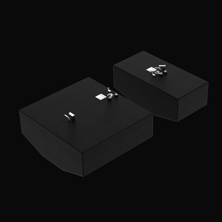 A high-angle isometric studio view of a matched dual-tank package featuring physical, finished black encapsulated Grady-White 282 Sailfish Main (140 gal) and Auxiliary (66 gal) OEM replacement marine fuel tanks from file image_f3287a.jpg, isolated against a black background. The foreground highlights the larger 140-gallon main tank showing its tapered V-bottom deadrise, while the 66-gallon auxiliary tank is positioned slightly behind it. Both rectangular cells are precision-fabricated from heavy-gauge marin