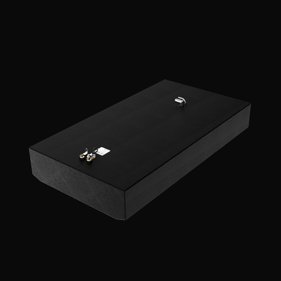 A studio isometric perspective view of a physical, finished black encapsulated Grady White Freedom 255-257 OEM replacement marine fuel tank (135 gal) from file image_98f4be.jpg, isolated against a black background. Precision-fabricated from heavy-gauge marine-grade 5052-H32 aluminum, the long rectangular tank body features a tapered V-bottom deadrise custom-engineered to sit flush within the vessel's center-cavity bilge compartment. The entire body is fully encapsulated in a protective, textured black TarGa