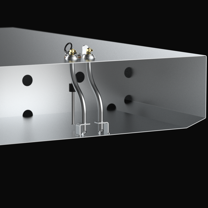 A 3D CAD cutaway cross-section view revealing the internal geometry and anti-slosh baffle system of a Grady White Freedom 255-257 OEM replacement marine fuel tank (135 gal) from file image_99139c.jpg, isolated against a black background. Precision-engineered from heavy-gauge marine-grade 5052-H32 aluminum, the exposed interior chamber features an internal baffle wall with circular flow-pass holes alongside dual curved aluminum fuel pickup tubes extending down to foot sumps in the angled bottom deadrise. A v