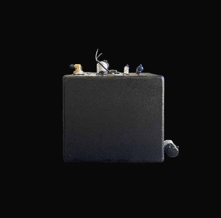Front elevation view of the Hewes 18 Redfisher replacement fuel tank (26 gal). Shows the distinct lower fill elbow connection designed for hatch fitment, along with top-mounted fittings and black-coated aluminum body.