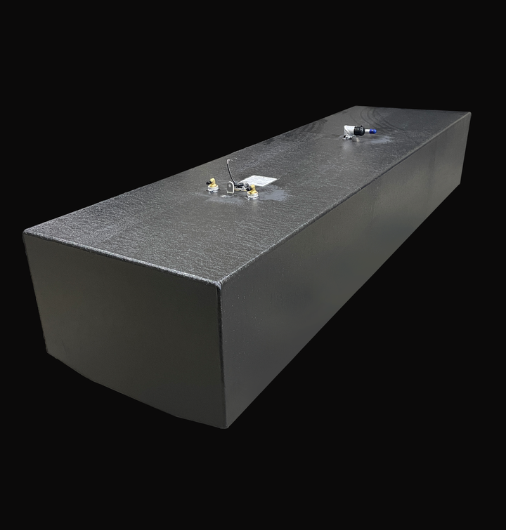 A 192-gallon Hydra Sport 25 (1994) belly fuel tank featuring a full Coal Tar Epoxy coating for maximum corrosion resistance. The image shows the long-profile design with precision-welded fuel pickups, sender unit, and 90-degree vent fittings, engineered for a guaranteed OEM fit in the center stringer cavity.