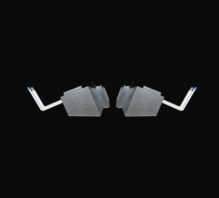 A head-on end elevation studio view showing a matched mirror-image pair of physical Jupiter 31 Cuddy port and starboard OEM replacement marine fuel tanks (105 gallons each) from file image_4a8e60.png, isolated against a black background. This cross-sectional end perspective clearly illustrates the custom mirrored deadrise angles and tapered bottom profiles, engineered to fit symmetrically into the outboard stringer bays of the hull. Precision-fabricated from heavy-gauge marine-grade 5052-H32 aluminum, both 