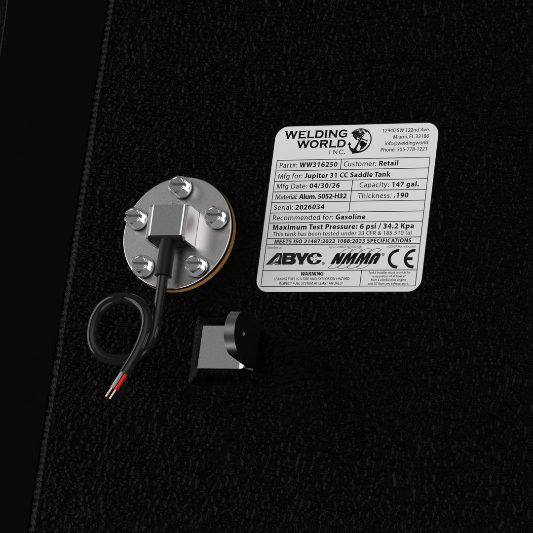Close-up view of the Welding World Inc. manufacturing label on a Jupiter 31 CC Saddle Tank, verifying a 147-gallon capacity and .190" thickness 5052-H32 aluminum construction. The image shows the integrated KUS fuel sender and certifications for ABYC, NMMA, and CE standards. Finished in protective black Coal Tar Epoxy, this tank is part of a 100% guaranteed drop-in fit OEM replacement kit.