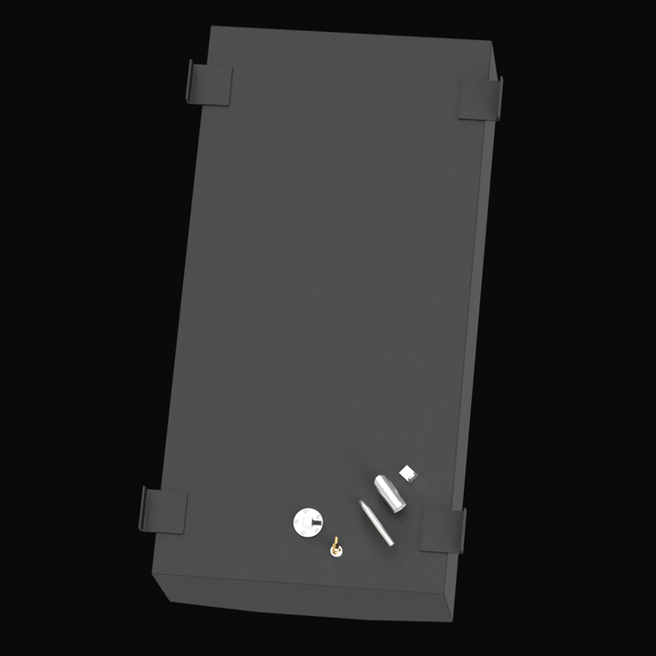 3D render of a black rectangular marine fuel tank viewed from a high angle, showing four large mounting brackets on each corner and multiple fittings near one shorter edge, including a round metal plate, a brass valve, and several silver cylindrical and rectangular components.