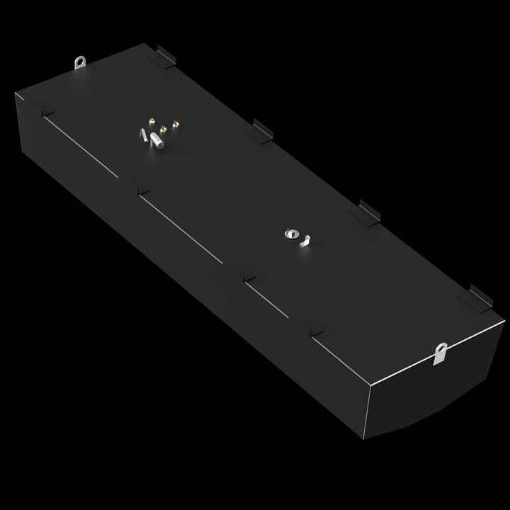 A dark grey, elongated rectangular fuel tank with a slightly curved bottom, viewed from an elevated angle against a black background. The top surface features several golden-colored fittings, a white pipe, and a circular opening with a silver rim. Multiple L-shaped brackets are visible along the edges of the top surface, along with a silver D-ring at one end and another D-ring visible at the far end